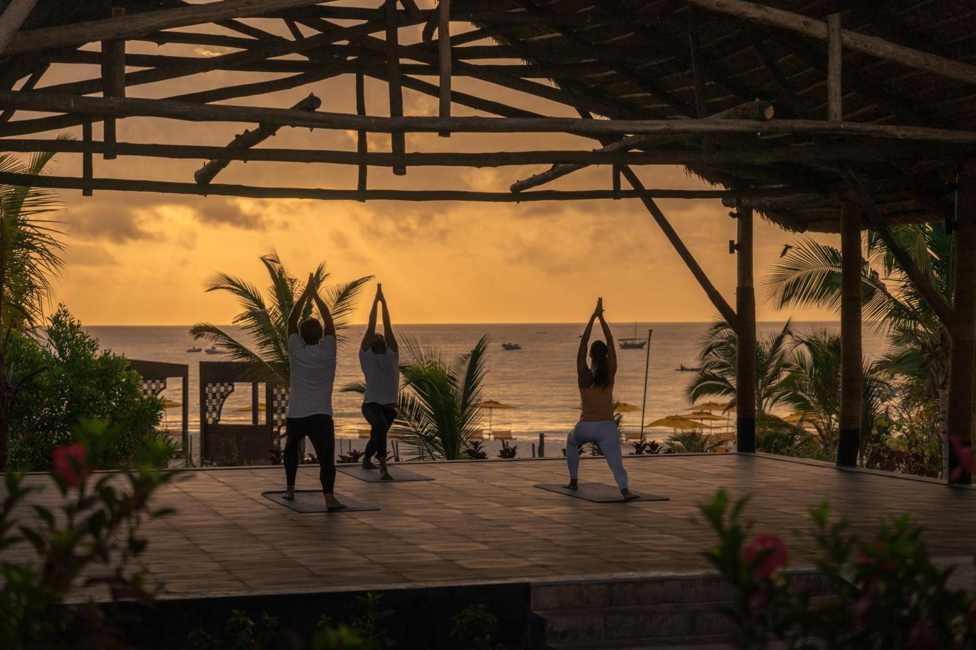 Hotel The Mora Zanzibar Matemwe  Esterno foto Sunset yoga at the beach